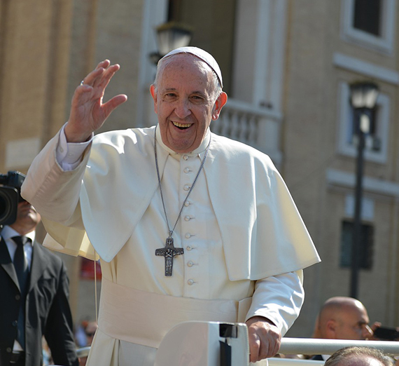 Cardinal Michael Czerny standing at a podium. 